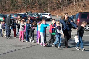Students on morning of shooting in Newtown, CT. Newtown Bee photo.