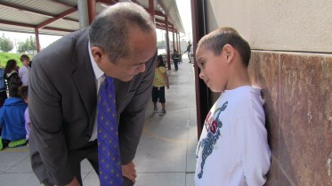 When a child gets in trouble, Principal Godwin Higa talks quietly to the student to sort things out. 