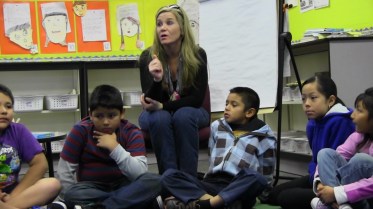 Wendy Lindman-Fechner guides her third-graders in a discussion of personal goals during their morning meeting. 