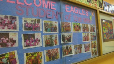 The year's "Super Me's" on display in El Dorado Elementary School. Each week, one child from each grade level is chosen. "They love it," says Principal Silvia Cordero. The awards are announced on the playground before schools starts every Friday morning. The kids scream with joy as each winner is announced.