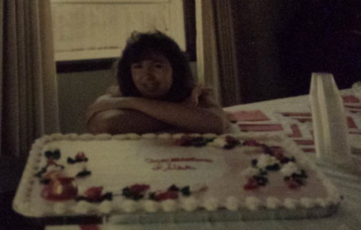 Leisa at graduation celebration, 1987