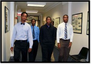 One Summer Chicago Plus program youth walk down an office hallway, an environment some had never experienced. CREDIT: Youth Outreach Services