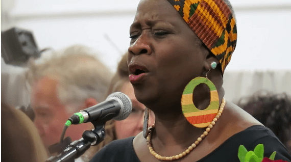 Hiland Mountain Lullaby Project Director Shirley Mae Springer Staten, sings a “Thank you” at the end of their first concert in the gym of the Hiland Mountain Correctional Facility. Anchorage professional musicians and Hiland women composed personal lullabies for their children. 